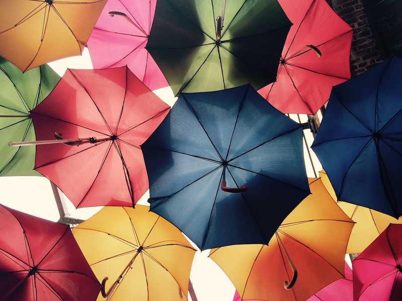 Variety of different colored umbrellas.